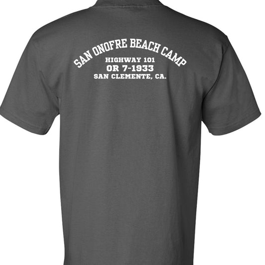 A dark gray short-sleeve t-shirt showing the back, which features a white printed graphic reading 'SAN ONOFRE BEACH CAMP HIGHWAY 101 OR 7-1933 SAN CLEMENTE, CA.' on a plain white background.